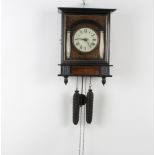 A Continental striking hanging wall clock with 10cm paper dial, Roman numerals, contained in a