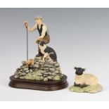A Border Fine Arts figure of a shepherd and sheep dog 17cm on a wooden stand together with a ditto