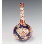 A 19th Century Imari bottle vase with panels of flowers 30cm