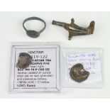 Two Roman silver denarius, a fibula and a ring