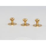 Three 18ct yellow gold dress studs, 4 grams