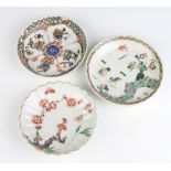 An 18th Century Chinese scalloped dish decorated with a butterfly amongst flowering peony 13cm,
