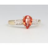 A 9ct yellow gold fire opal and diamond ring, 1.9 grams, size N
