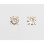 A pair of 18ct white gold brilliant cut diamond ear studs 1.18ct, colour J/K, clarity SI