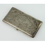 An Indian repousse silver rectangular silver cigarette case 142 grams, stamped 800