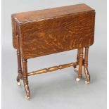 A Victorian oak Sutherland table raised on turned supports 59cm h x 56cm w x 16cm when closed x 68cm