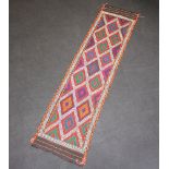 A red, turquoise and white ground Suzni Kilim runner 271cm x 67cm