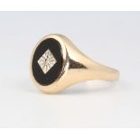 A gentleman's 9ct yellow gold onyx and diamond ring, 3.8 grams, size Q