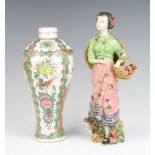 A 19th Century Cantonese baluster vase decorated with panels of figures, pavilion landscapes and