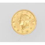 An 1853 1 dollar coin 1.6 grams