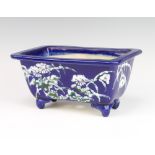 A Chinese blue ground rounded rectangular jardiniere decorated with flowers 13cm