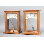 Two large electrical meters, calibrated from 0-10, contained in mahogany cases 35cm h x 24cm w x
