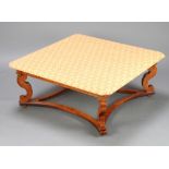 An 18th Century style square walnut coffee table with printed fabric top raised on cabriole supports