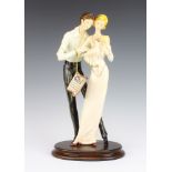 A Capodimonte group of a mother father and child, signed A Santini 42cm