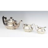A matched silver demi-fluted 3 piece tea set, London 1900 and Chester 1900, gross weight 1068 grams