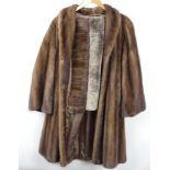 A lady's full length mink coat together with ditto stole and a simulated fur stole