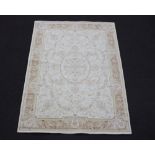 A yellow floral patterned Aubusson style rug 193cm x 137cm