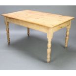 A Victorian rectangular pine kitchen table, raised on turned supports 75cm h x 139cm l x 88cm w
