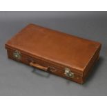 A light brown leather suitcase with chrome mounts 16cm h x 76cm w x 42cm w