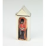 A modern sterling silver and enamelled vesta in the form of a guardsman in a sentry box 41 grams,