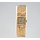 A lady's 9ct yellow gold Omega wristwatch and bracelet 28.7 grams