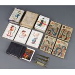 A set of Georgian paper playing cards with plain backs, a set of Cheery Families cards with part