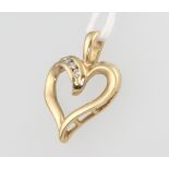 A 9ct yellow gold heart shaped diamond pendant 22mm, 1.8 grams