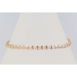 A 9ct yellow gold diamond tennis bracelet, 19cm, 6.4 grams gross