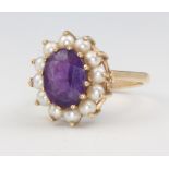 A 9ct yellow gold amethyst and seed pearl ring size N, 3.9 grams