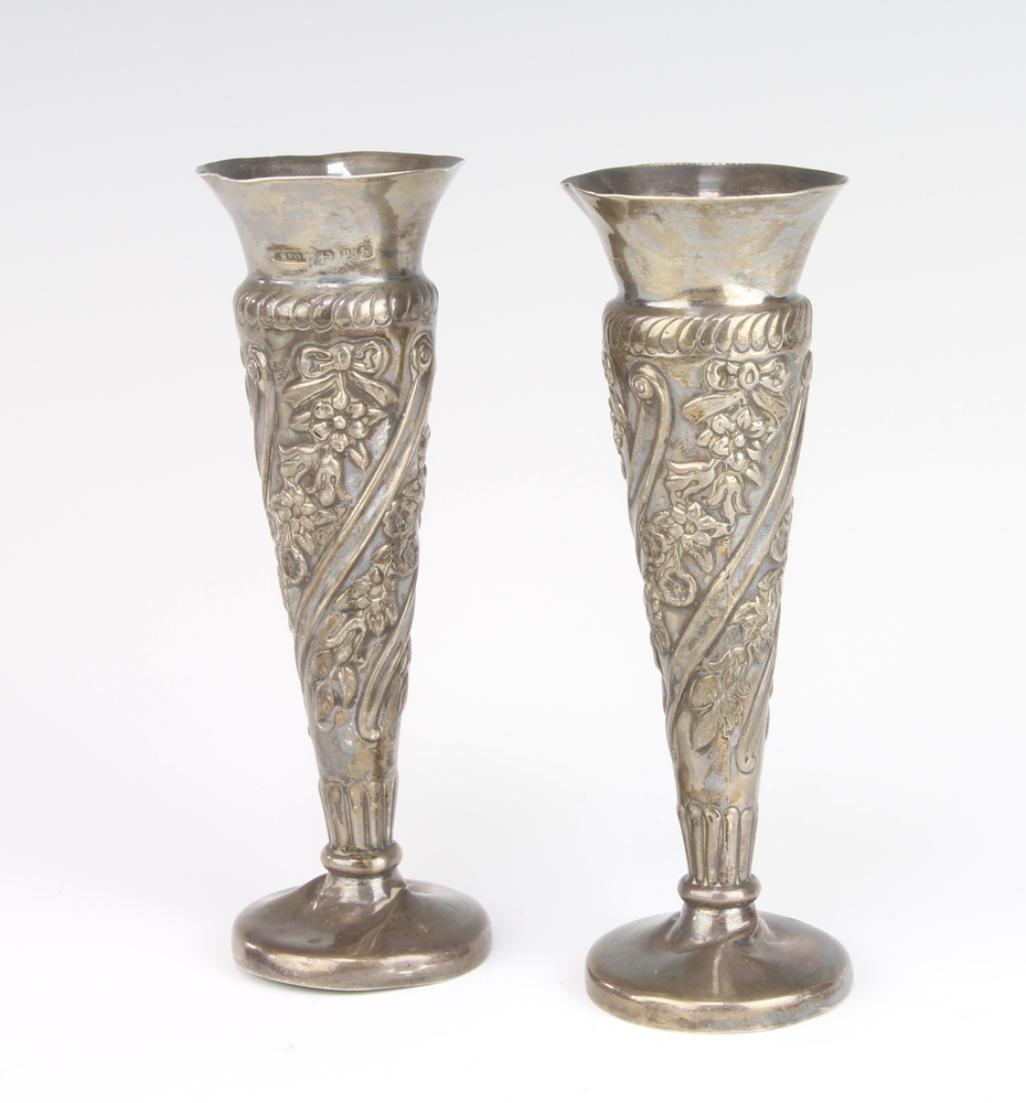 A pair of Victorian repousse silver spill vases Birmingham 1898 12cm, 58 gramsBoth are dented