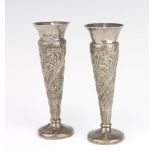 A pair of Victorian repousse silver spill vases Birmingham 1898 12cm, 58 gramsBoth are dented