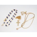 Three 9ct yellow gold necklaces and a 9ct cross pendant 5.7 grams together with a seed pearl and