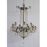 A gilt metal and glass 14 light candle lit chandelier having 2 bulbs to the centre 75cm h x 56cm
