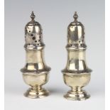 A pair of Victorian silver pepperettes Sheffield 1890, 153 grams