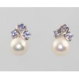 A pair of 9ct white gold pearl and tanzanite ear studs 2.9 grams