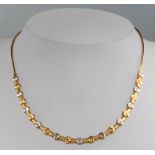 An 18ct 2 colour gold necklace, 9.6 grams