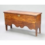 An 18th/19th Century elm coffer of panelled construction with hinged lid, fitted a candle box to the