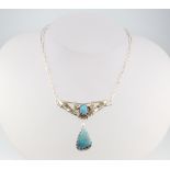 An Art Nouveau style silver and opal drop pendant with leaf decoration