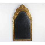 A 19th Century arched plate mirror contained in a gilt frame surmounted by a shell 70cm h x 36cm w