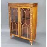 A Georgian mahogany bookcase fitted adjustable shelves, enclosed by astragal glazed panelled