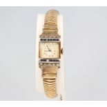 A lady's Art Deco style 9ct yellow gold sapphire and diamond set cocktail watch, 24 grams groos