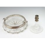 A circular cut glass ashtray with 800 standard mount 18cm together with a mounted candlestick 12cm