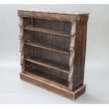 A Victorian carved oak bookcase fitted adjustable shelves raised on a platform base 113cm h x x