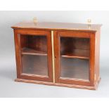 A 19th Century mahogany hanging display cabinet, fitted shelves enclosed by glazed panelled door