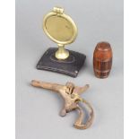 A glass inkwell contained in a carved and turned wooden barrel shaped case 5cm x 2cm, a 19th Century