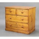 A Victorian pine chest of 2 short and 2 long drawers with brass escutcheons and replacement tore