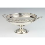 A silver bowl with pierced border and fancy handle, Birmingham 1919, 30cm, 559 grams