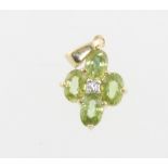 A 9ct yellow gold 4 stone peridot pendant