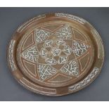 An Eastern copper inlaid circular charger 36cm diam.