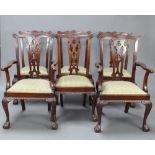 A set of 6 Edwardian Chippendale style mahogany dining chairs with pierced vase shaped slat backs